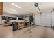 Spacious three car garage with ample lighting, work bench and car at 1981 Trophy Elk Ave, Logandale, NV 89021