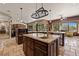 Gourmet kitchen features granite counters, island with sink, and stainless steel appliances at 1981 Trophy Elk Ave, Logandale, NV 89021