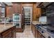 Kitchen boasts granite counter tops, stainless appliances and adjacent walk in pantry at 1981 Trophy Elk Ave, Logandale, NV 89021