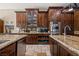 Kitchen offers custom cabinets, stainless appliances and views into pantry room at 1981 Trophy Elk Ave, Logandale, NV 89021