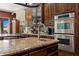 Close up of gourmet kitchen, stainless steel oven, granite counters and custom cabinets at 1981 Trophy Elk Ave, Logandale, NV 89021