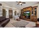 Comfortable living room featuring a large entertainment center, ample seating, and stylish decor at 1981 Trophy Elk Ave, Logandale, NV 89021