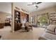 Comfortable living room with built-in shelves and light-filled views of the backyard at 1981 Trophy Elk Ave, Logandale, NV 89021