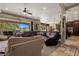 Open-concept living room with comfortable seating and large sliding doors for seamless indoor-outdoor living at 1981 Trophy Elk Ave, Logandale, NV 89021