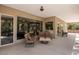 Covered patio with comfortable seating, overlooking the lush backyard and providing an ideal outdoor living space at 1981 Trophy Elk Ave, Logandale, NV 89021