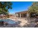 Stunning pool area with rock features, spa, and lush landscaping, perfect for relaxation at 1981 Trophy Elk Ave, Logandale, NV 89021