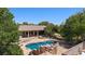 Beautiful pool area with rock features and landscaping with view of home at 1981 Trophy Elk Ave, Logandale, NV 89021
