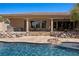 Backyard pool and patio area, complete with a built-in grill and ample seating at 1981 Trophy Elk Ave, Logandale, NV 89021