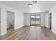 Bedroom with stylish wood flooring and walk out to balcony at 2080 Karen Ave # 60, Las Vegas, NV 89169