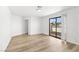 Bright bedroom with wood flooring and sliding doors to balcony at 2080 Karen Ave # 60, Las Vegas, NV 89169
