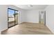 Bright bedroom with stylish flooring and sliding door to balcony at 2080 Karen Ave # 60, Las Vegas, NV 89169