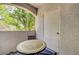 Cozy balcony featuring a round table, chair, and lovely tree view, offering a relaxing outdoor space at 2615 W Gary Ave # 2013, Las Vegas, NV 89123