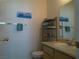 Bathroom with a vanity, toilet, towel rack, and a decorative painting at 2615 W Gary Ave # 2013, Las Vegas, NV 89123