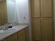 Bright bathroom featuring a vanity with sink, large mirror, and plenty of cabinet space at 2615 W Gary Ave # 2013, Las Vegas, NV 89123