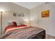 Bedroom featuring wood floors, a queen bed, and neutral decor for a peaceful retreat at 2615 W Gary Ave # 2013, Las Vegas, NV 89123