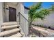 Exterior front door entrance featuring stairs, black railing, and the unit number 2013 at 2615 W Gary Ave # 2013, Las Vegas, NV 89123
