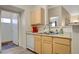 Open kitchen shows a double stainless steel sink and bright, light wood cabinets at 2615 W Gary Ave # 2013, Las Vegas, NV 89123