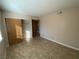 Bedroom featuring tile floors and a closet with wood-look doors at 2685 Bryandouglas Dr, Las Vegas, NV 89121
