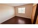 Bright bedroom featuring hardwood floors, a window, and neutral walls at 2685 Bryandouglas Dr, Las Vegas, NV 89121