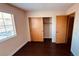 Cozy bedroom featuring hardwood floors, two closets, and a window at 2685 Bryandouglas Dr, Las Vegas, NV 89121
