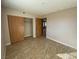 Bedroom with a tile floor and large closet with wood-look doors at 2685 Bryandouglas Dr, Las Vegas, NV 89121