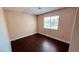 Neutral bedroom with hardwood floors, natural light from a window at 2685 Bryandouglas Dr, Las Vegas, NV 89121
