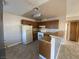 Functional kitchen design with tile floor, wooden cabinets, and standard appliances at 2685 Bryandouglas Dr, Las Vegas, NV 89121