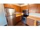 Bright kitchen featuring wood cabinets, stainless appliances, and light countertops at 2685 Bryandouglas Dr, Las Vegas, NV 89121
