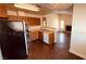 Open concept kitchen featuring stainless steel appliances, wood cabinets, and breakfast bar at 2685 Bryandouglas Dr, Las Vegas, NV 89121