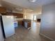 Open-concept kitchen with tile floor, standard appliances, and view into the living room at 2685 Bryandouglas Dr, Las Vegas, NV 89121