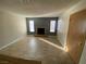 Cozy living area with tiled floor, natural light, and brick fireplace at 2685 Bryandouglas Dr, Las Vegas, NV 89121