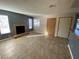 Bright living room with fireplace and large windows providing ample natural light at 2685 Bryandouglas Dr, Las Vegas, NV 89121
