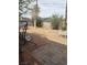 Expansive backyard offers desert landscaping, patio area, mature trees and perimeter block wall at 2724 Natalie Ave, Las Vegas, NV 89121