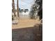 Spacious backyard featuring desert landscaping, patio area, mature shade trees and perimeter block wall at 2724 Natalie Ave, Las Vegas, NV 89121