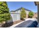 Landscaped backyard with modern water feature and view of the home at 2827 Turnstone Ridge St, Henderson, NV 89044