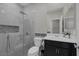 Modern bathroom with tiled shower, stylish fixtures, and sleek vanity at 2827 Turnstone Ridge St, Henderson, NV 89044