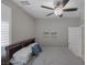Comfortable bedroom with a ceiling fan, bright window, and minimalist decor at 2827 Turnstone Ridge St, Henderson, NV 89044