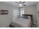 Cozy bedroom with neutral walls, ceiling fan, and comfortable furnishings at 2827 Turnstone Ridge St, Henderson, NV 89044