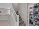 Open entryway featuring tiled floors, carpeted stairs, and pantry space with shelving at 2827 Turnstone Ridge St, Henderson, NV 89044