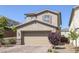 Charming two-story home with a brick driveway and well-maintained landscaping at 2827 Turnstone Ridge St, Henderson, NV 89044