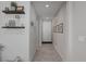 Welcoming hallway with decorative shelves and neutral color palette at 2827 Turnstone Ridge St, Henderson, NV 89044