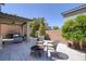 Outdoor patio area featuring a fire pit, seating area, and low-maintenance landscaping at 2827 Turnstone Ridge St, Henderson, NV 89044