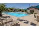 Community pool and seating offer relaxation at 2827 Turnstone Ridge St, Henderson, NV 89044