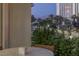 Picturesque balcony view with greenery, offering a peek of distant mountains and city buildings at 2857 Paradise Rd # 305, Las Vegas, NV 89109