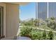Relax on the balcony with mountain and city views, surrounded by lush greenery and tall palm trees at 2857 Paradise Rd # 305, Las Vegas, NV 89109