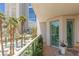 Outdoor balcony features city views with mature palm trees with sliding glass doors at 2857 Paradise Rd # 305, Las Vegas, NV 89109