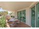 This outdoor balcony features a table with tile floors and sliding glass doors at 2857 Paradise Rd # 305, Las Vegas, NV 89109