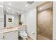 Well-lit bathroom featuring a walk-in shower and a single vanity with sink at 2857 Paradise Rd # 305, Las Vegas, NV 89109