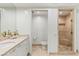 Bathroom featuring a vanity, toilet, and glass-enclosed shower with seating at 2857 Paradise Rd # 305, Las Vegas, NV 89109
