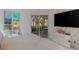 Bedroom with a large TV and balcony access offering views of the city at 2857 Paradise Rd # 305, Las Vegas, NV 89109